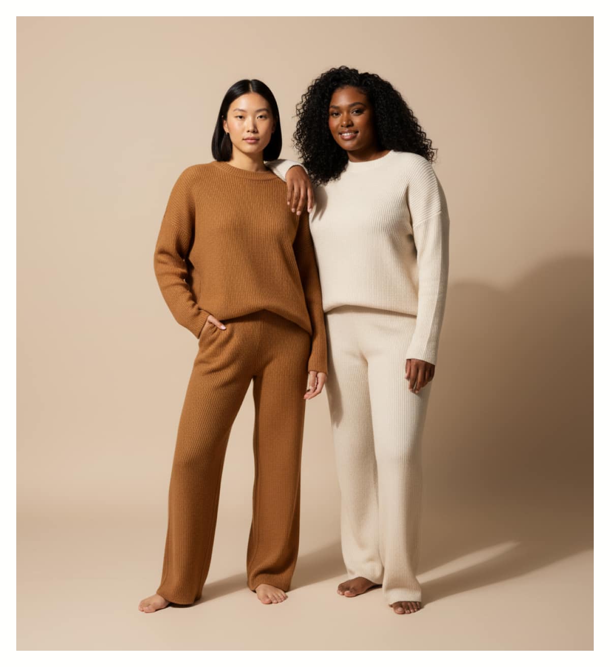 2 Women standing taking an image in lounge wear